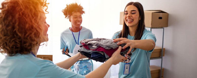 Volunteers handing out clothes.