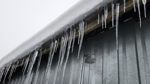 A building that has ice dams on it.