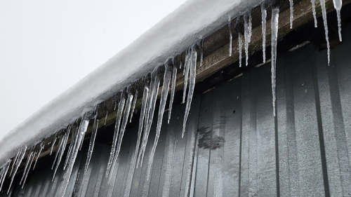 A building that has ice dams on it. 