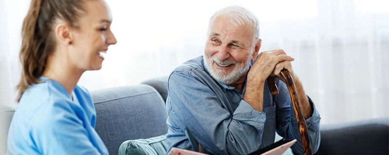 Two people smiling and laughing.