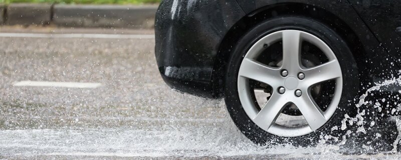 Car driving through puddles.