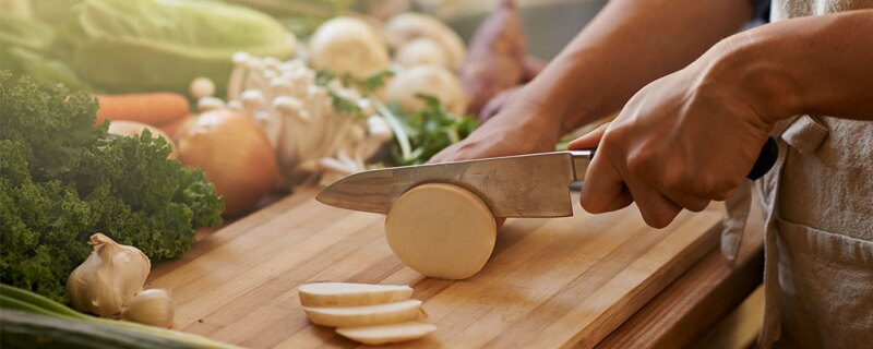 Someone cutting vegtables. 