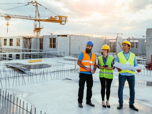 concrete workers inspecting job site