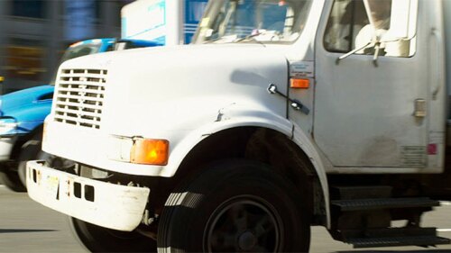 Truck driving on a road.