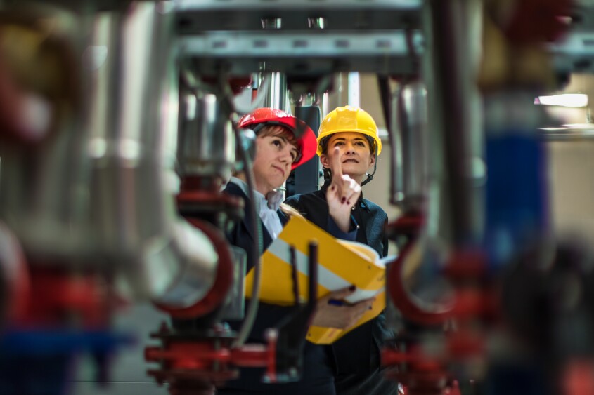 factory-inspectors-looking-at-equipment