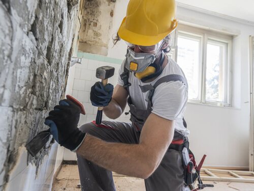 construction worker using hand tools