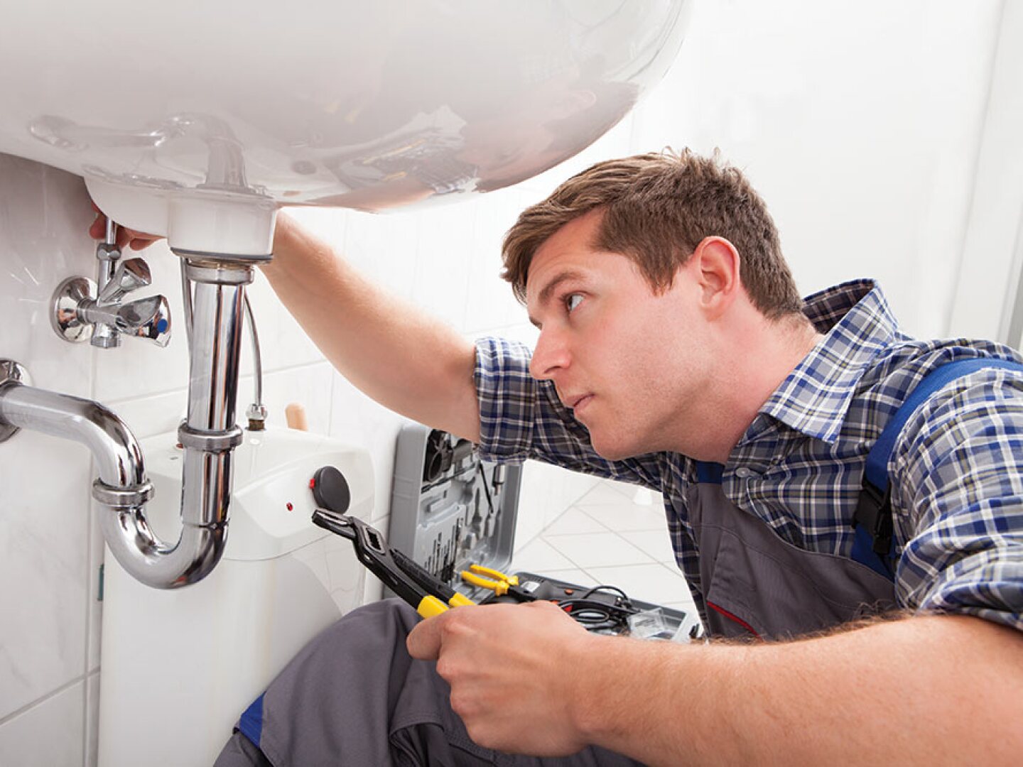 plumber-working-on-bathroom-sink.jpg