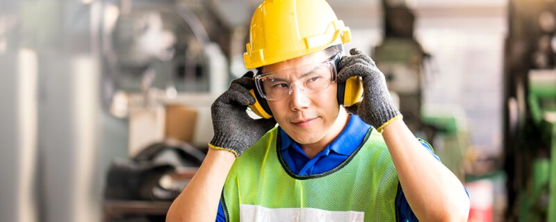 Worker put on his noise canceling headphones. 