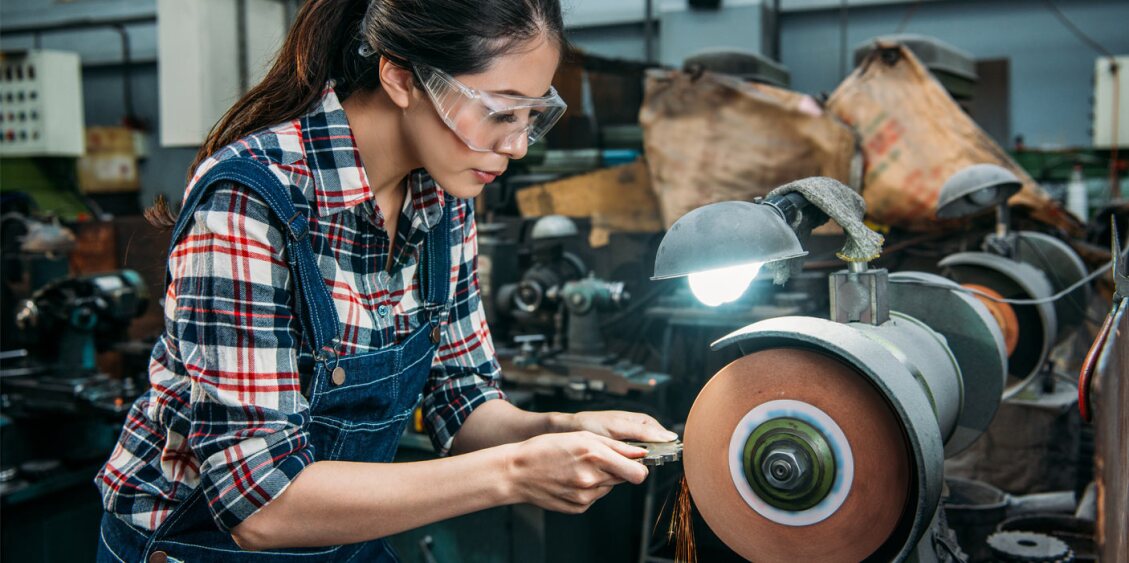 woman using a metal grinding wheel