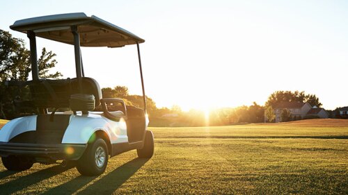Golf cart on a golf course.
