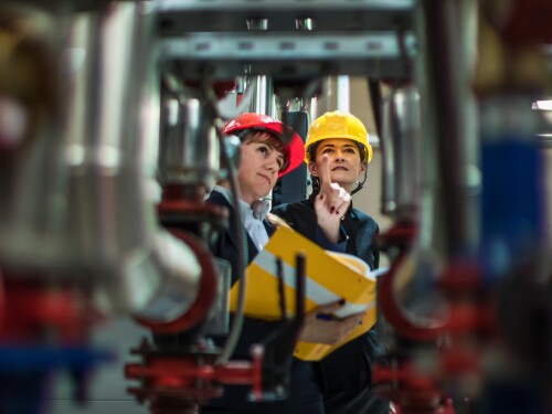 factory-inspectors-looking-at-equipment