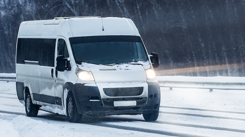 fleet vehicle driving in snow