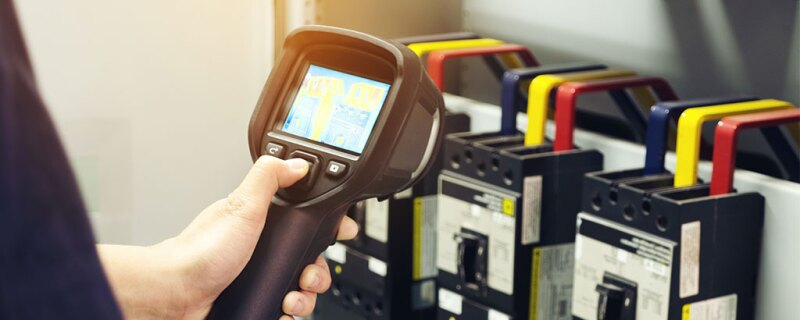 Someone using infrared thermometer