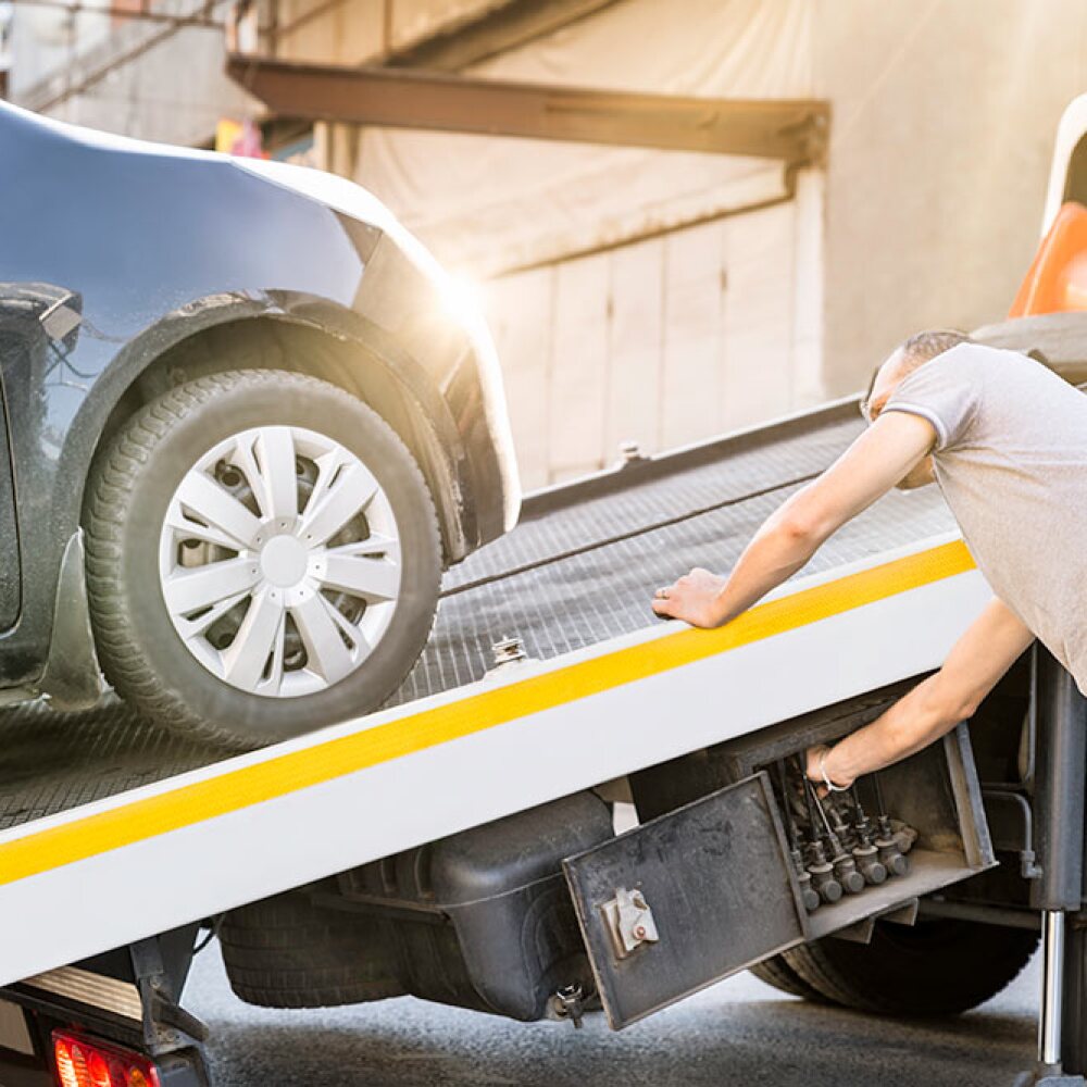 tow-truck-driver-loading-a-car.jpg