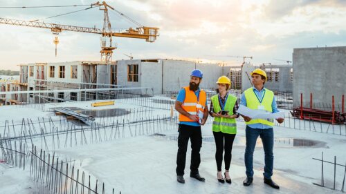 concrete workers inspecting job site