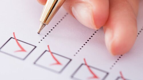 Someone checking off their checklist