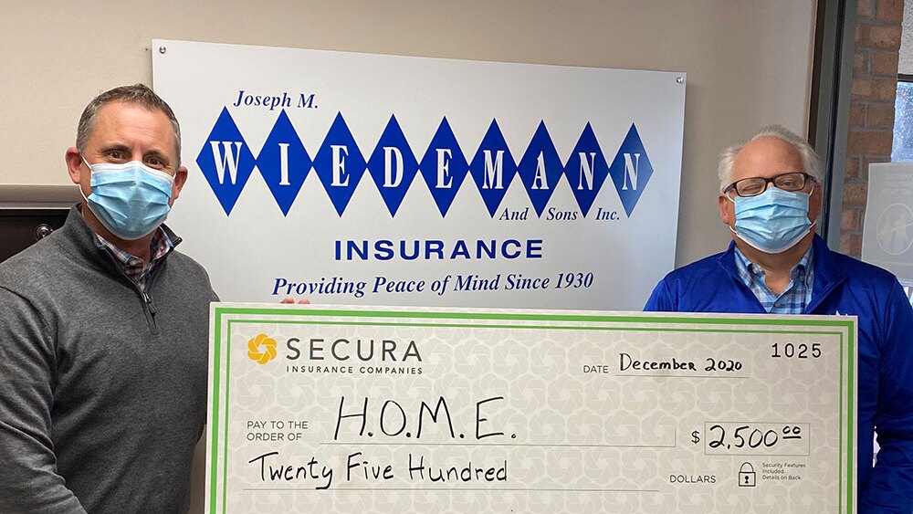 Joseph M. Wiedemann and Sons Inc and SECURA Insurance donating money to H.O.ME.