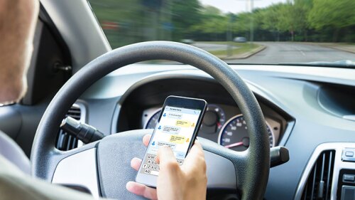 Someone texting and driving.