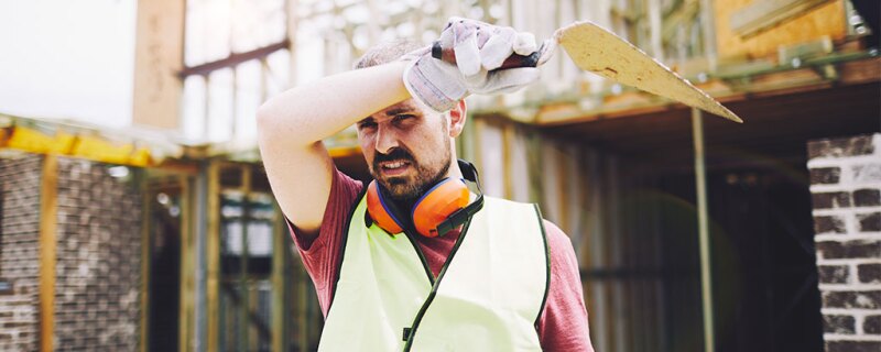 Photo of a tired construction worker. 